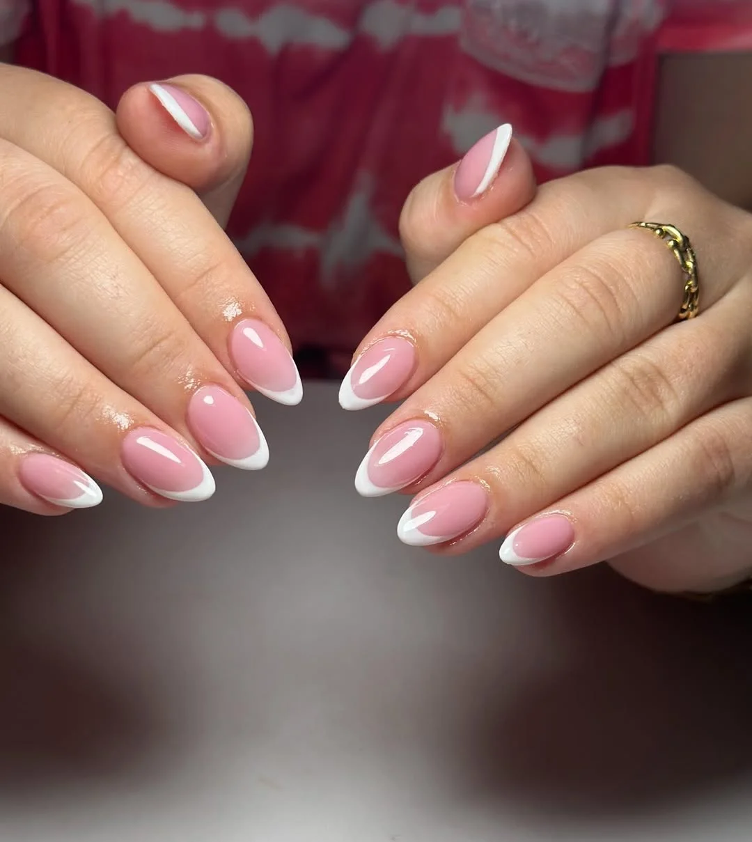 summer french tip nails 2026 Glossy Pink Almond French Tips With A Clean White Smile Line