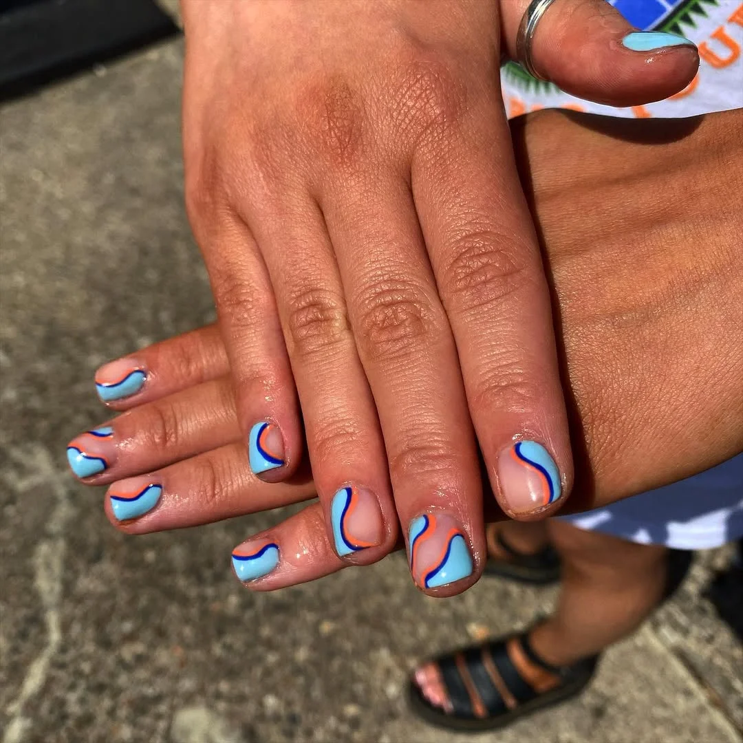 summer gel nails 2026 Sky Blue Wave Gel Nails With Playful Coral Lines