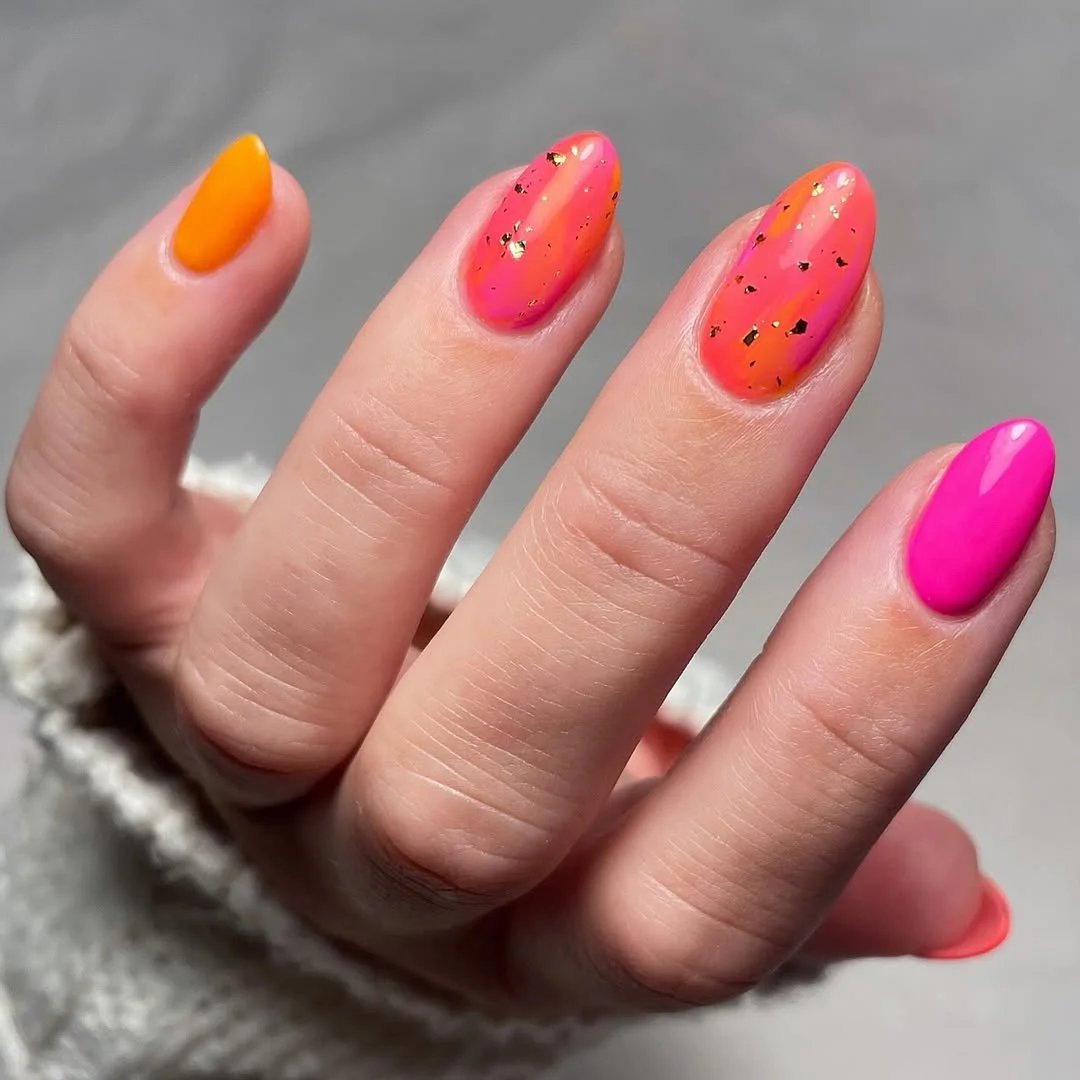 summer gel nails 2026 Pink Orange Sorbet Gel Nails With Gold Foil Sparkle