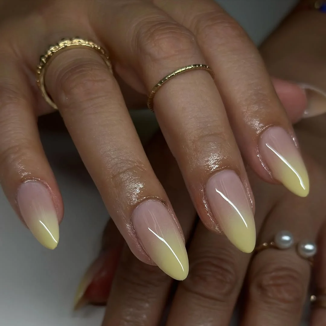 summer gel nails 2026 Lemon Ombre Almond Nails With A Glossy Sheer Base
