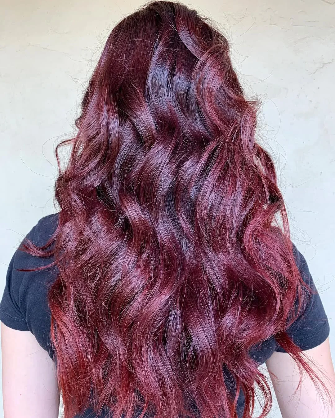 summer hair color ideas 2026 Berry Plum Waves With Glossy Violet Shine