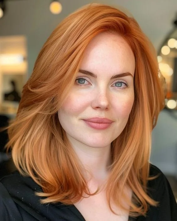 summer hair color ideas 2026 Soft Strawberry Copper With A Polished Side Sweep