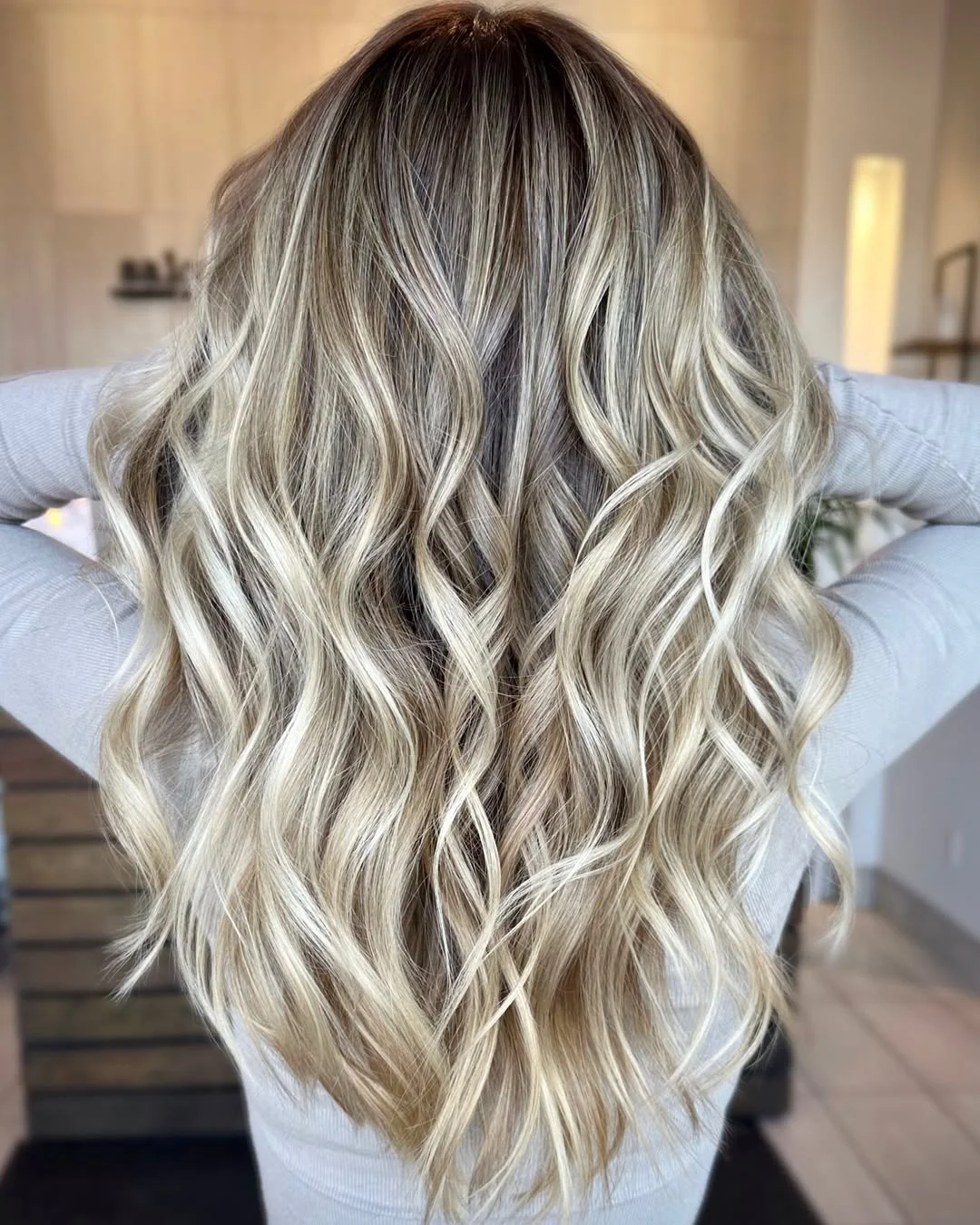 summer hair color ideas 2026 Rooted Icy Blonde Waves With Soft Dimension