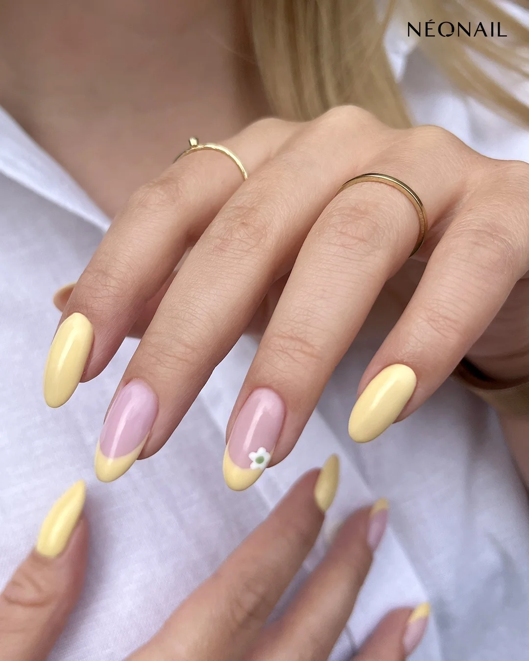 summer manicure color ideas 2026 Butter Yellow Almond Nails With A Tiny Daisy Accent