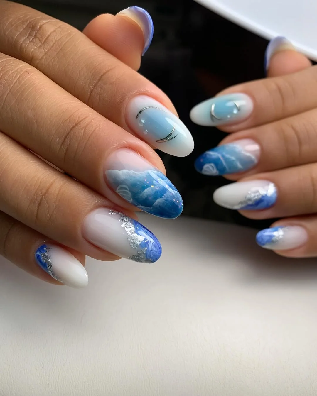 summer nail art 2026 Ocean Wave Blue Nails With Silver Accents