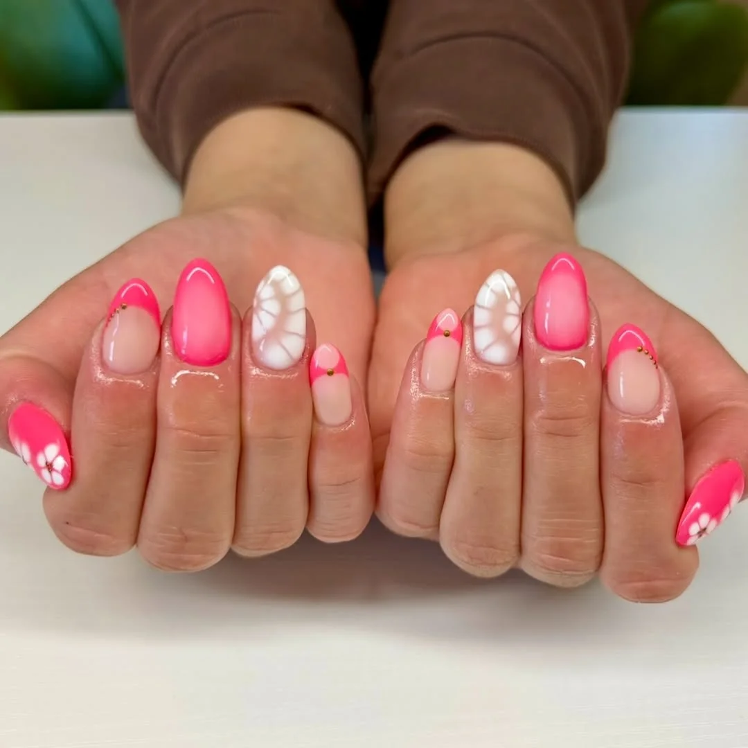 summer nail colors 2026 Pink Glow Nails With White Petal Accents