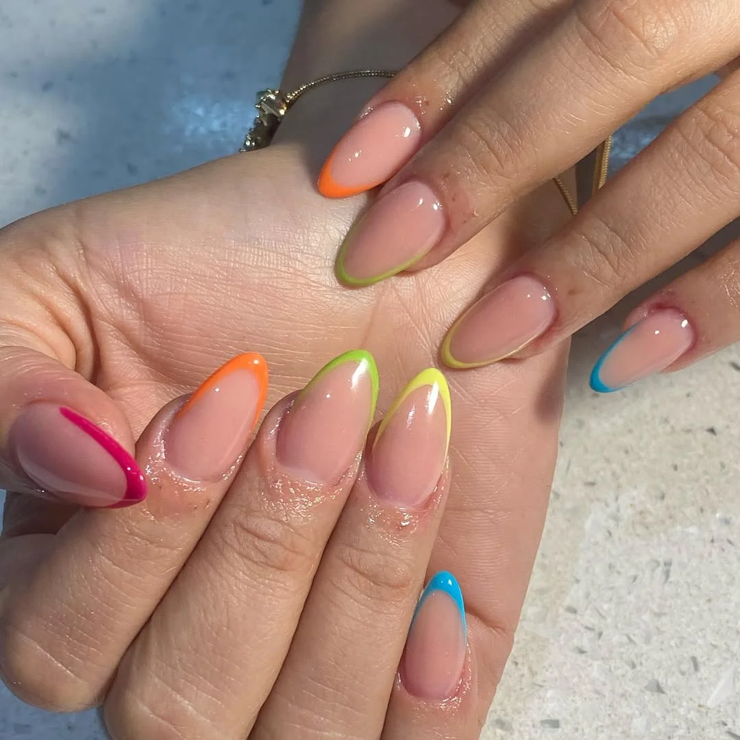 summer nail colors 2026 Neon French Tips On A Barely Pink Base