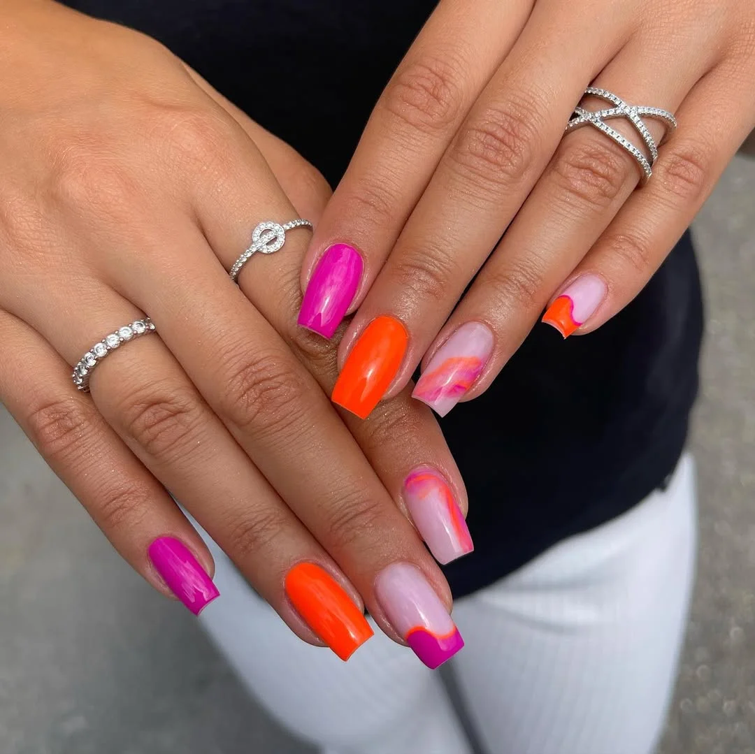 summer nail colors 2026 Hot Pink And Orange Nails With A Glossy Vacation Finish
