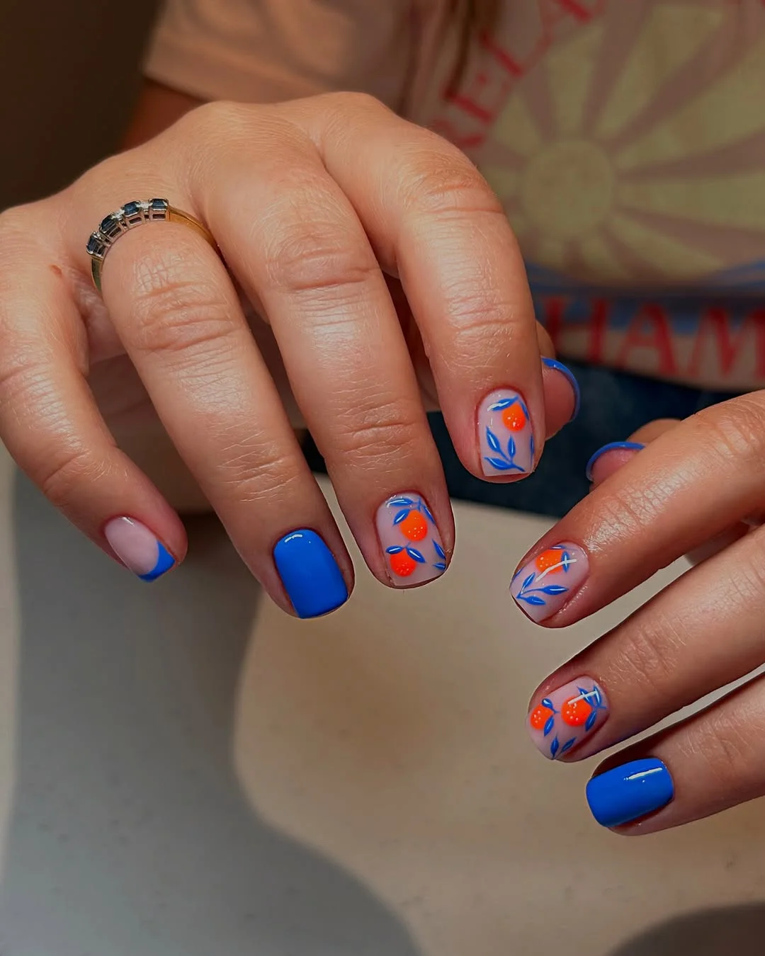 summer nail inspo 2026 Bright Blue Citrus Nails With Juicy Orange Accents