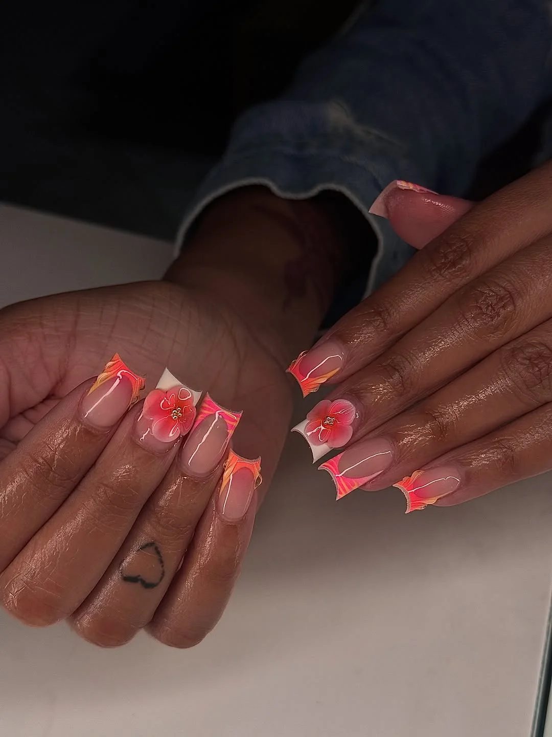summer nail inspo 2026 Sunset Coral Edge Nails With Tropical Flower Drama
