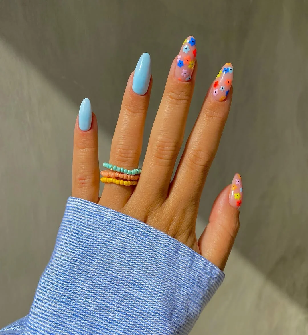 summer nail inspo 2026 Sky Blue Almond Nails With Confetti Flower Accents