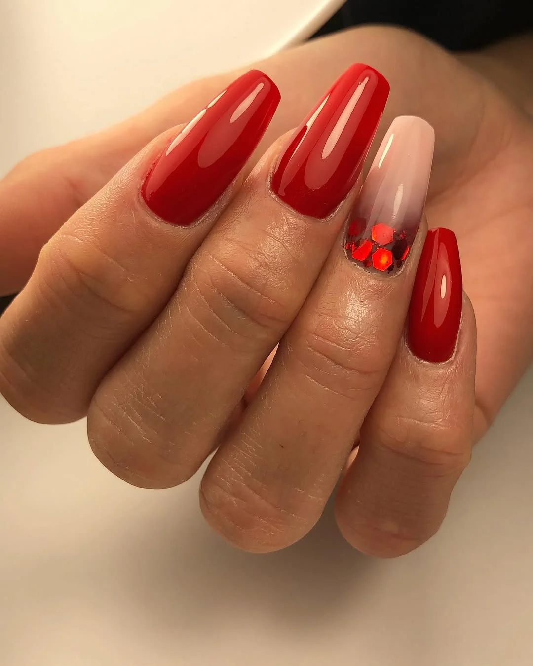 summer nails ballerina shape 2026 Glossy Red Ballerina Nails With A Sequined Accent Nail