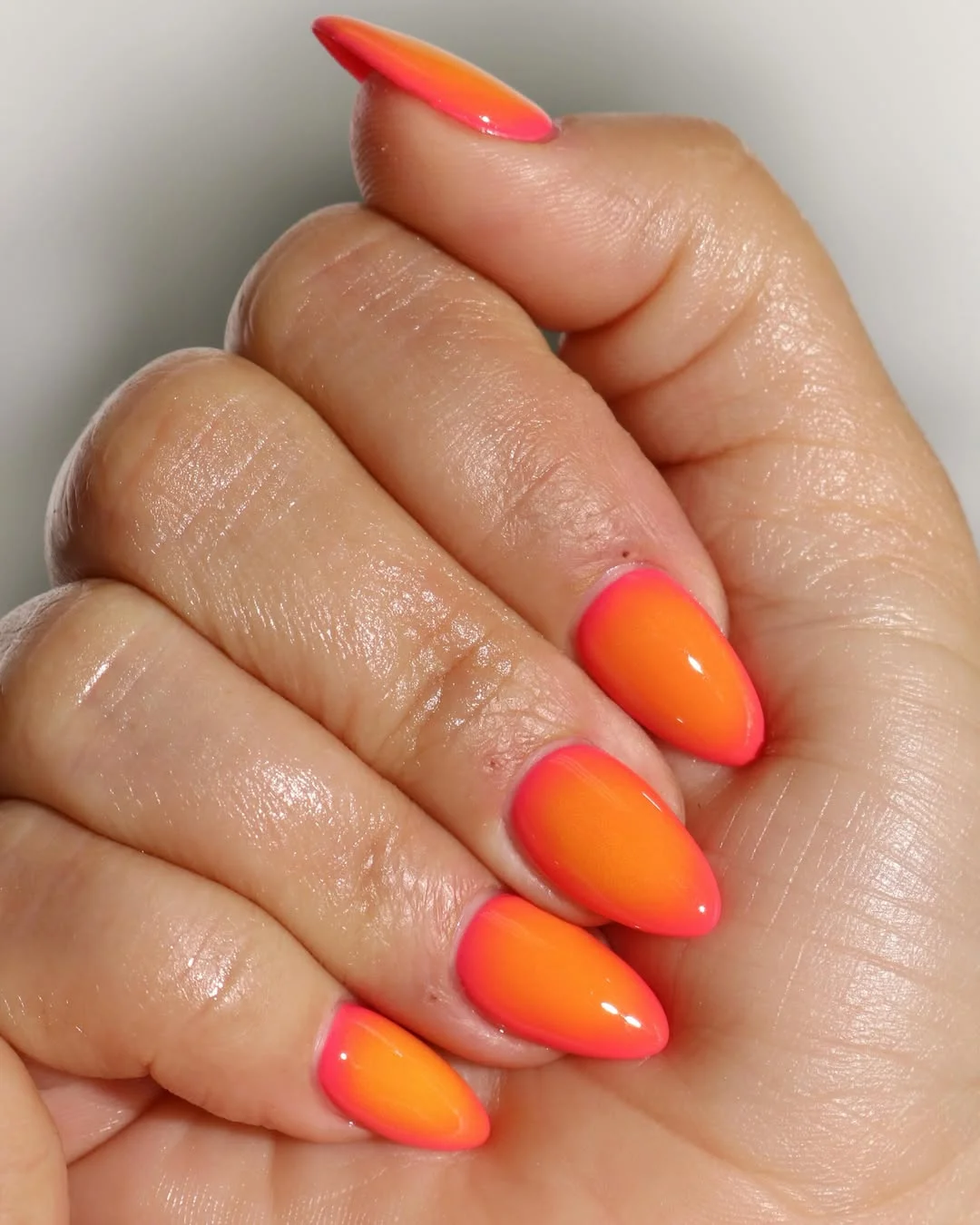 summer nails one color 2026 Pink And Orange Almond Ombre With A One-Color Mood