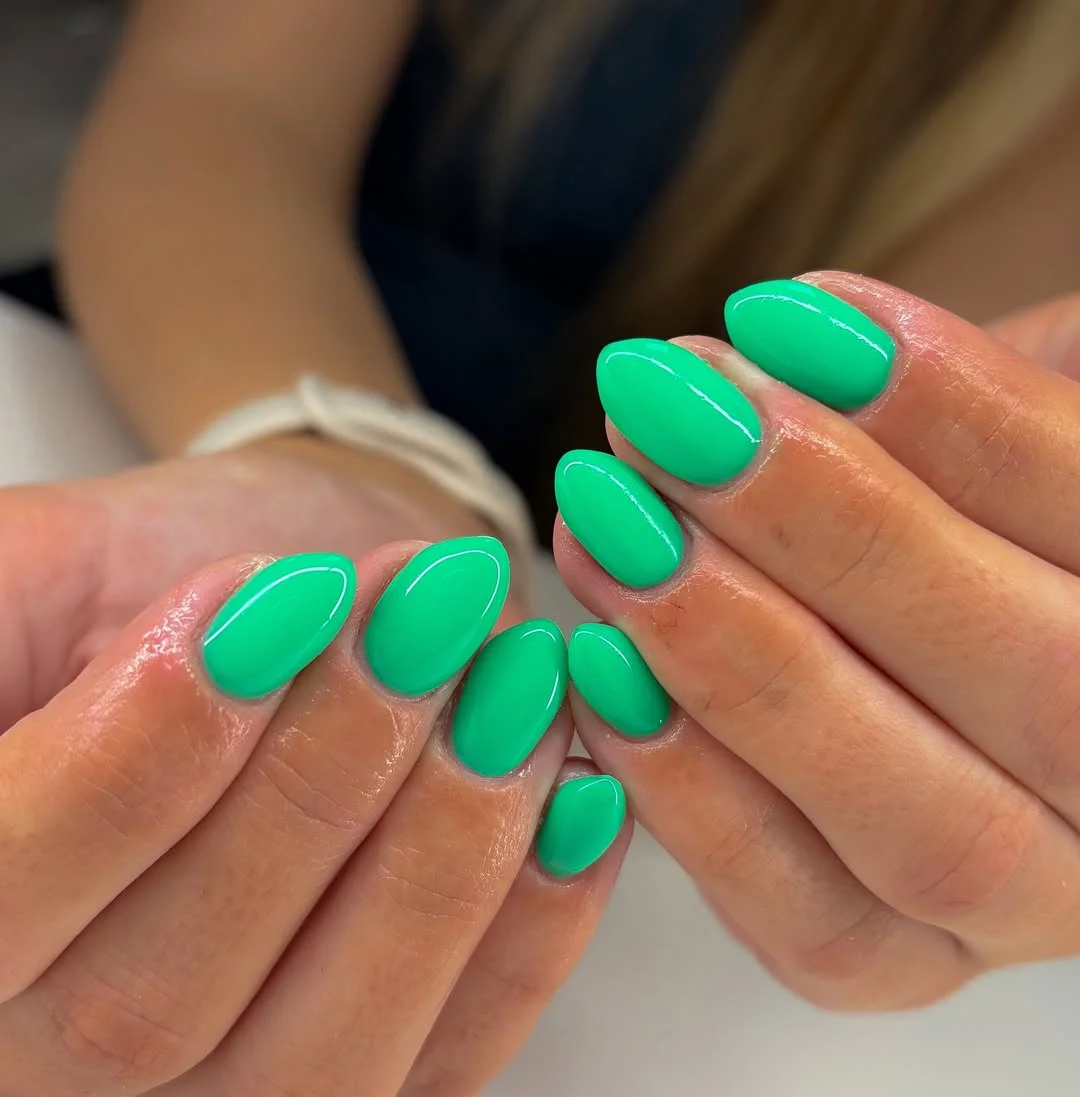 summer nails one color 2026 Glossy Green Almond Nails That Feel Fresh And Unexpected