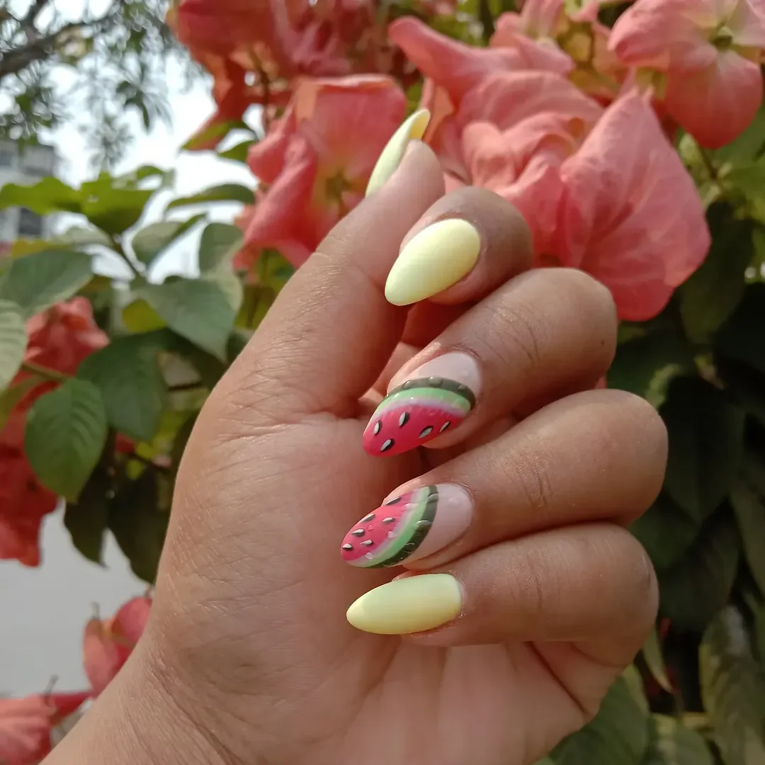 summer nails watermelon 2026 Pastel Yellow Almond Nails With Watermelon Slice Accents
