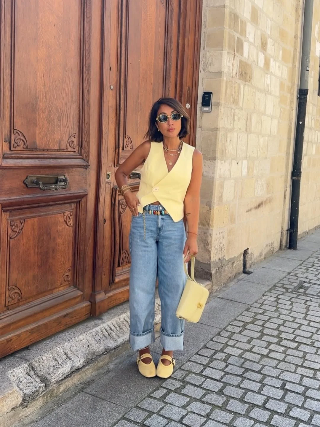 28 summer outfits for women 2026 Lemon Vest And Cuffed Jeans With Soft Retro Charm