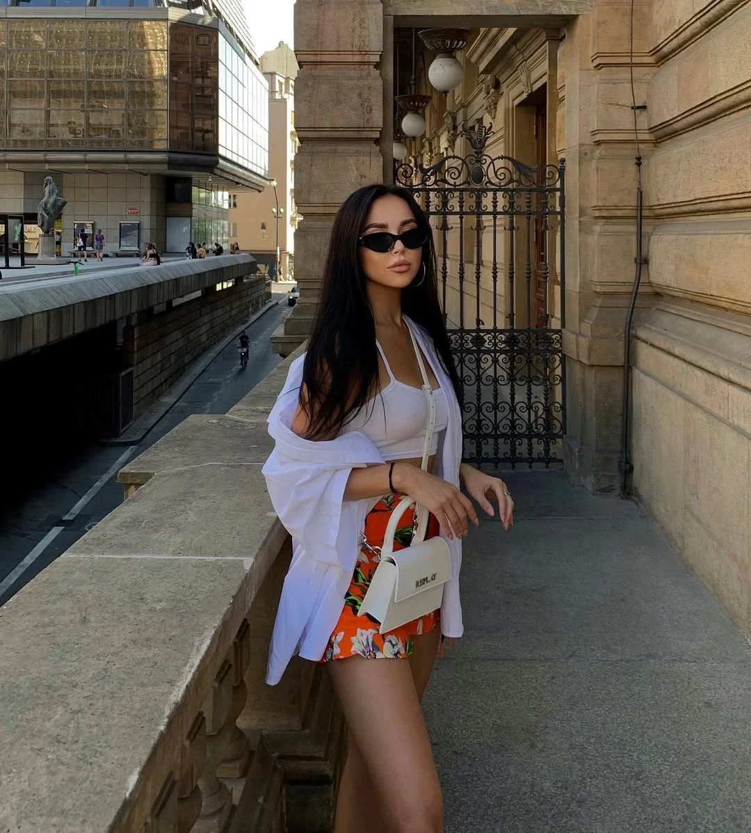 30 summer skirt outfits 2026 White Shirt Layer With A Floral Orange Mini Skirt