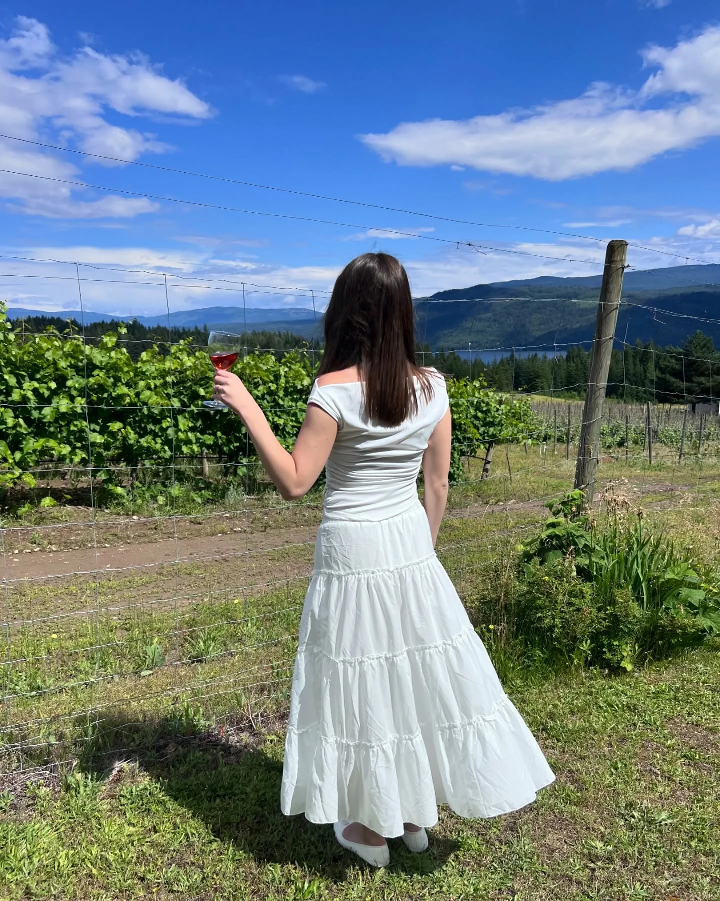 30 summer skirt outfits 2026 White Tiered Maxi Skirt With A Soft Summer Top