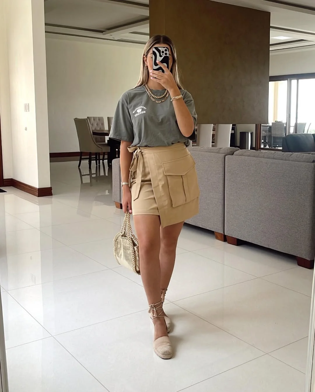 30 summer skirt outfits 2026 Graphic Tee With A Beige Utility Mini Skirt