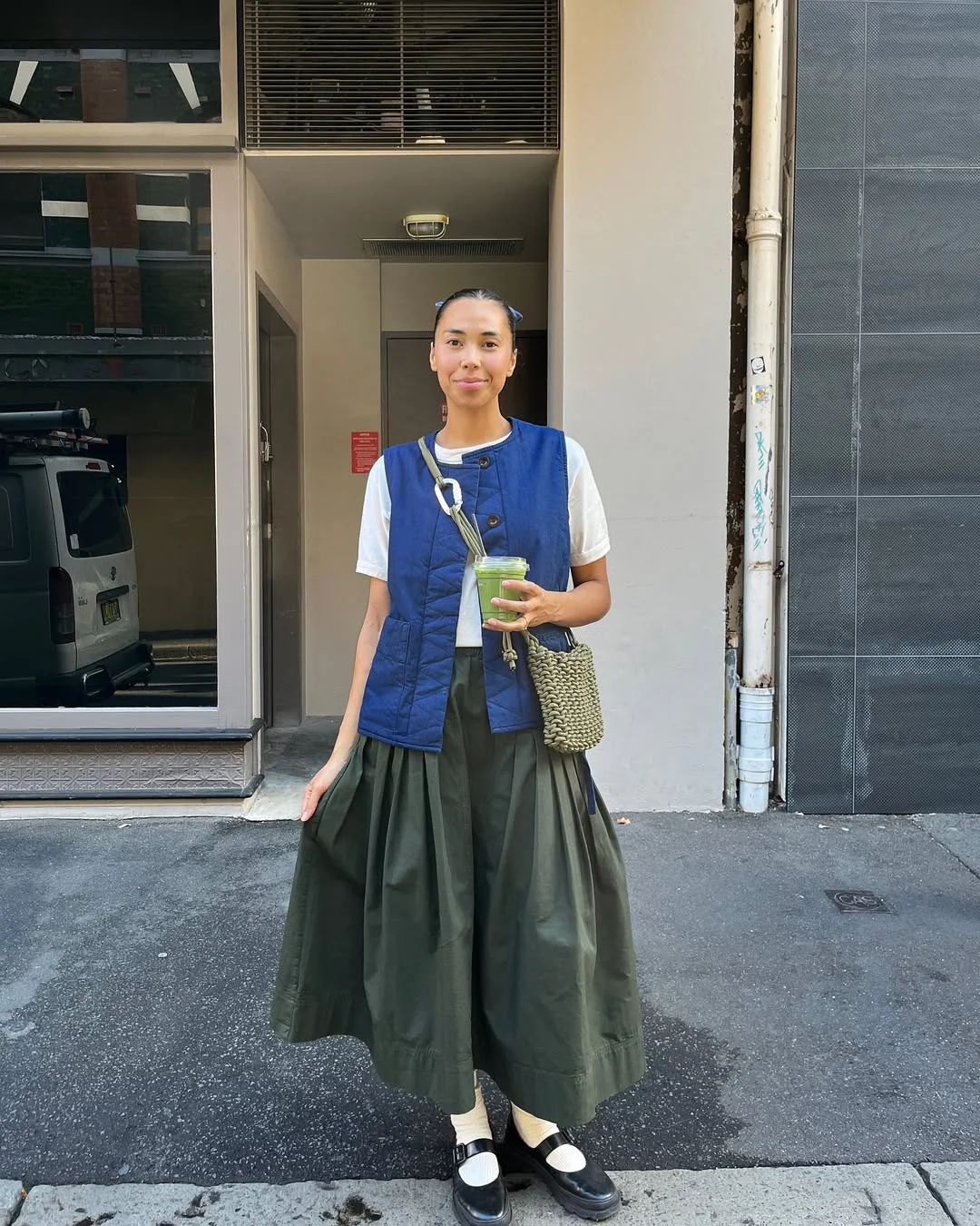 30 summer skirt outfits 2026 Quilted Blue Vest With An Olive Midi Skirt