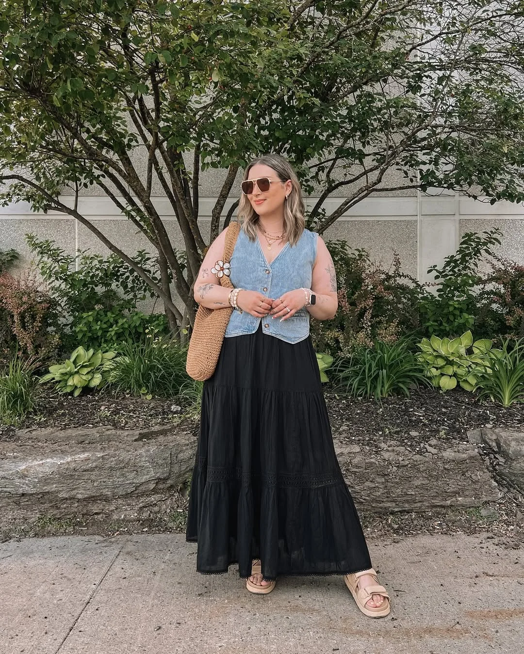 30 summer skirt outfits 2026 Denim Vest With A Black Tiered Maxi Skirt
