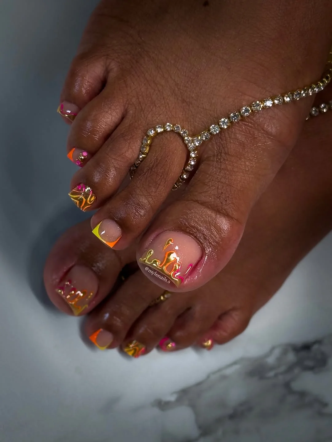 summer toe nails colors 2026 Neon Pink And Orange With Gold Waves