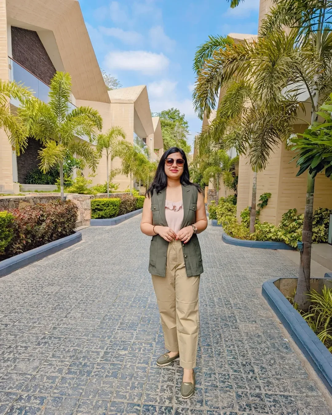 25 summer vacation resort outfits 2026 Olive Vest And Neutral Trousers For Resort Exploring