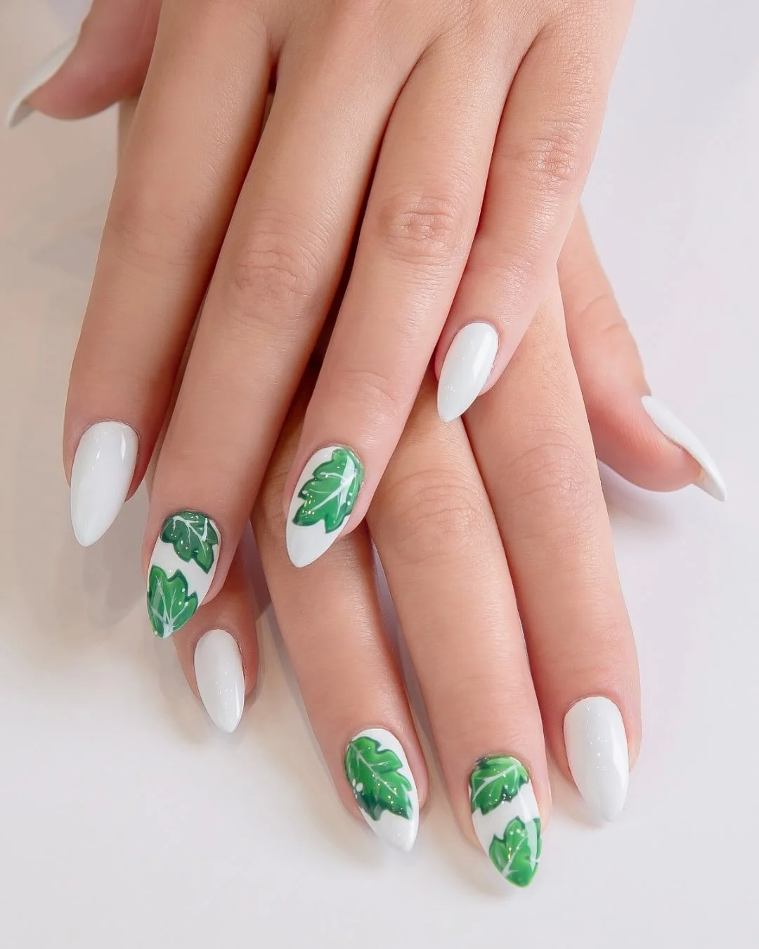summer vibrant nails summer 2026 Glossy White Nails With Tropical Green Leaf Art