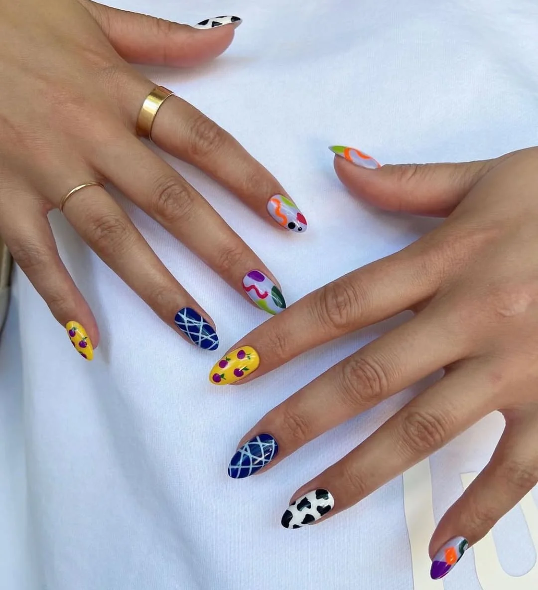 summer vibrant nails summer 2026 Playful Mixed Print Nails With Vacation-Ready Art