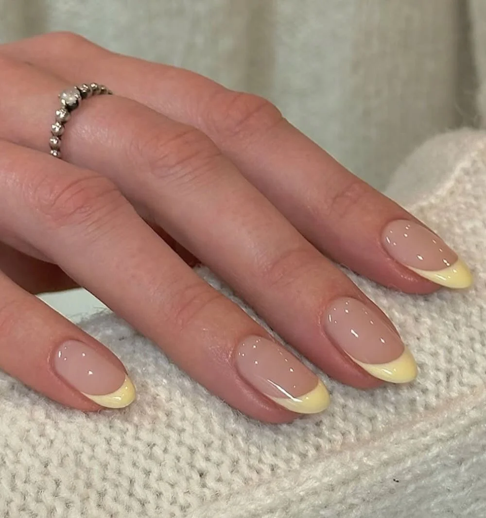 summer yellow nails 2026 Butter Yellow French Tips With a Soft Nude Base