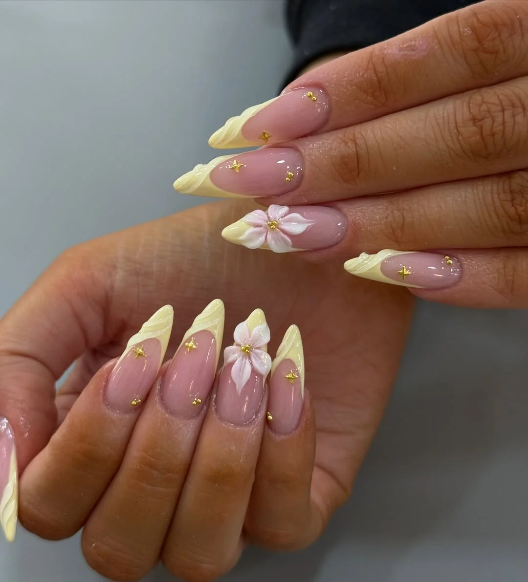 summer yellow nails 2026 Textured Butter Yellow Tips With White Floral Charms