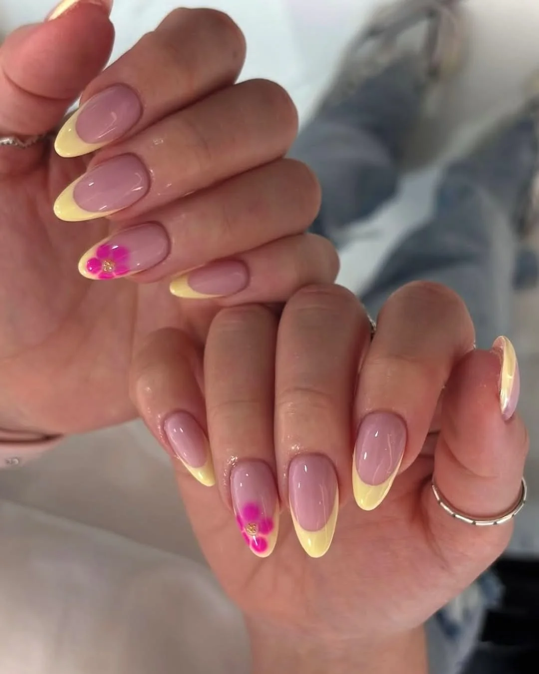 summer yellow nails 2026 Pink and Yellow French Nails With a Bright Floral Accent