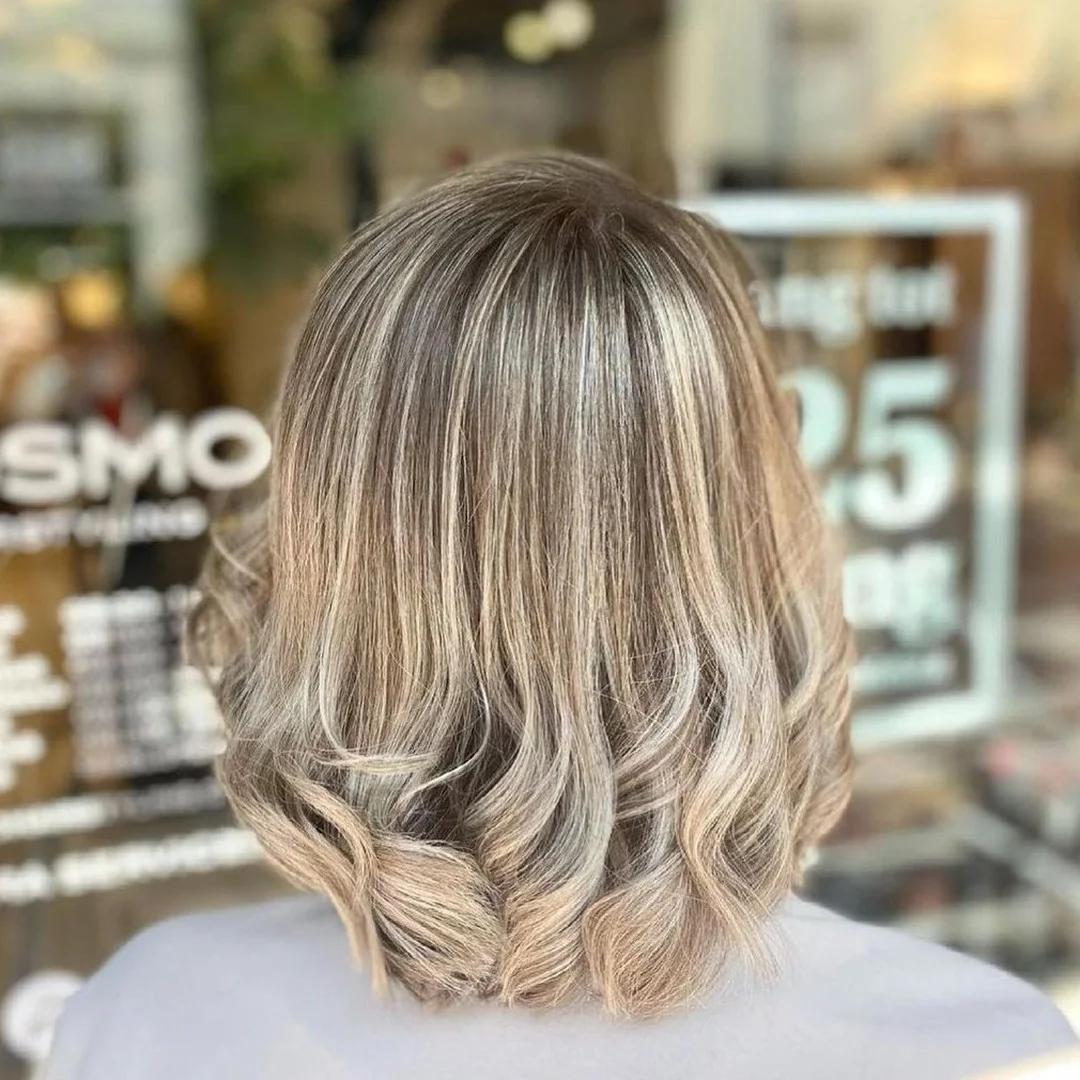 textured summer short hairstyles 2026 Rounded Blonde Bob With Soft Curled Ends