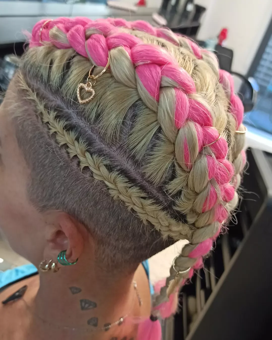 trendy summer braids hairstyle 2026 Pink And Blonde Braids With Shaved Side Detail