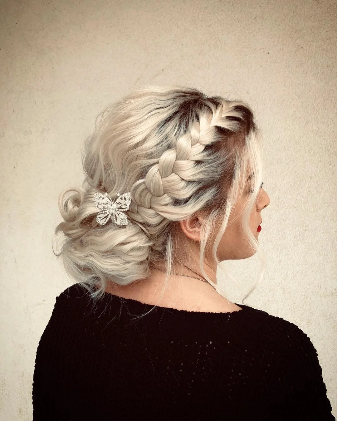 trendy summer braids hairstyle 2026 Romantic Blonde Side Braid With A Soft Low Bun