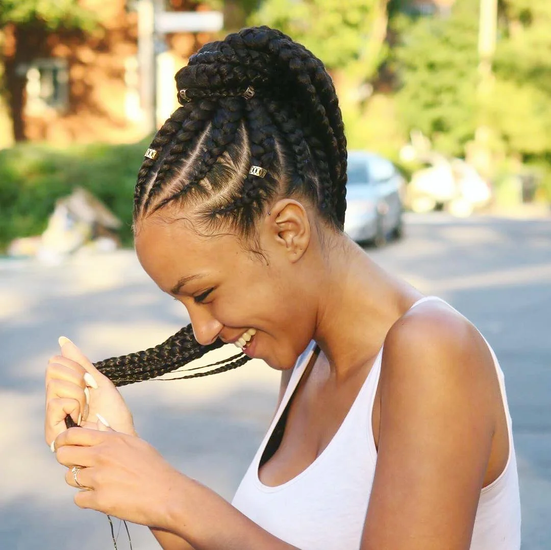 trendy summer hairstyle black women 2026 Chunky Cornrow Updo With Golden Hair Cuffs
