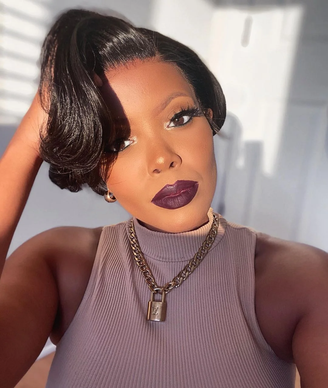 trendy summer hairstyle black women 2026 Glossy Side-Swept Bob With Vintage Drama