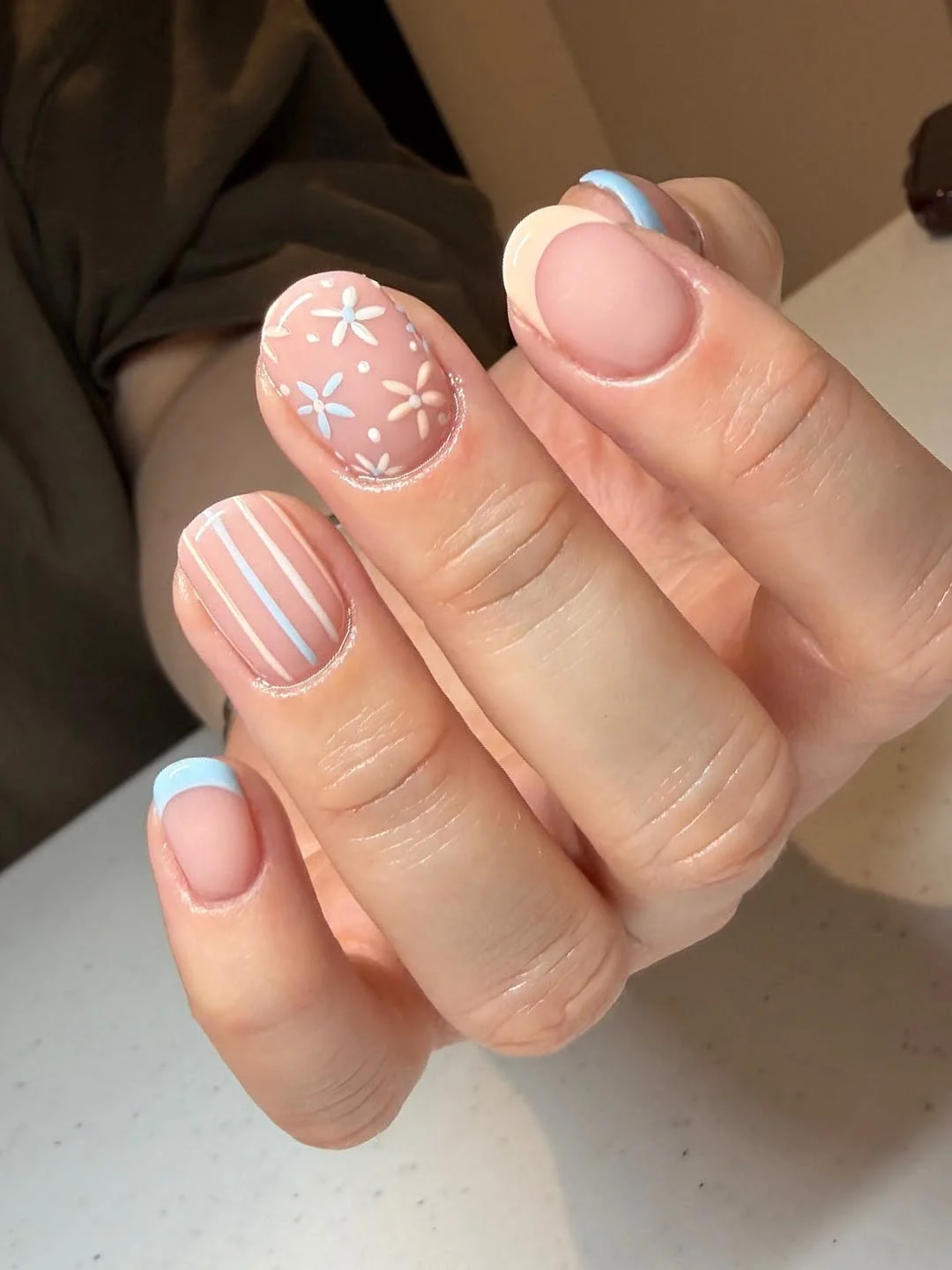 trendy summer nails 2026 Soft Baby Blue French Tips With Tiny Floral Details