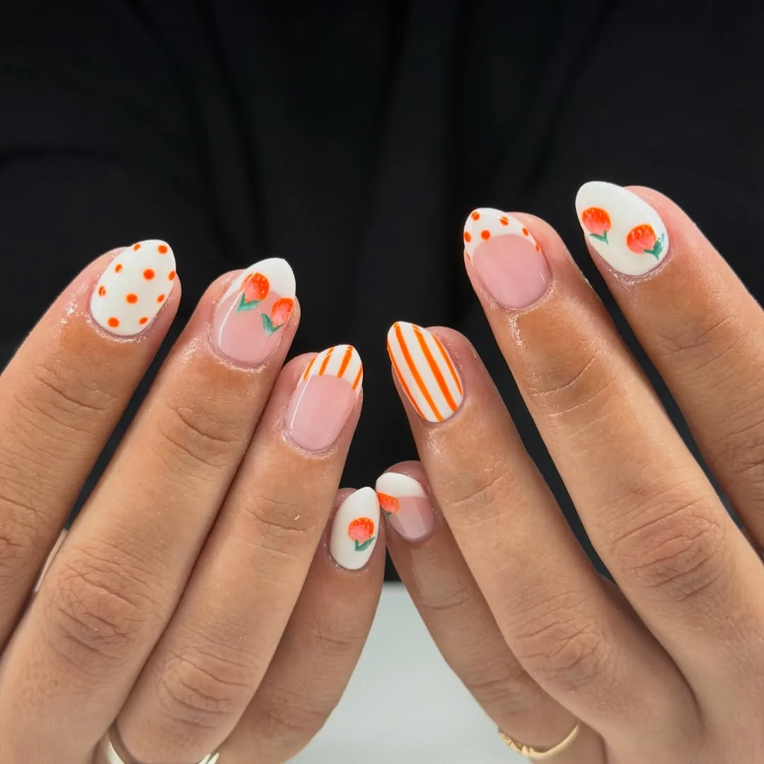 trendy summer nails 2026 Short Orange Floral Nails With Stripes And Dots