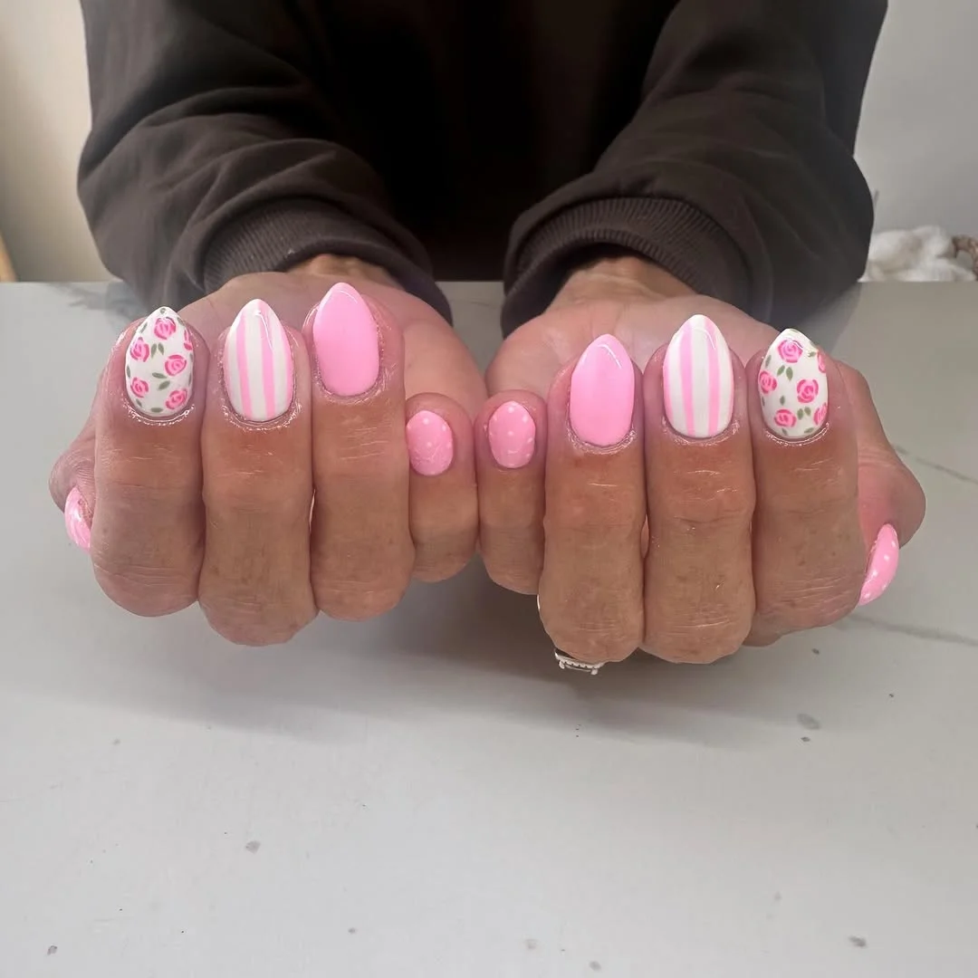 trendy summer nails 2026 Pink Rounded Nails With Roses Stripes And Dots