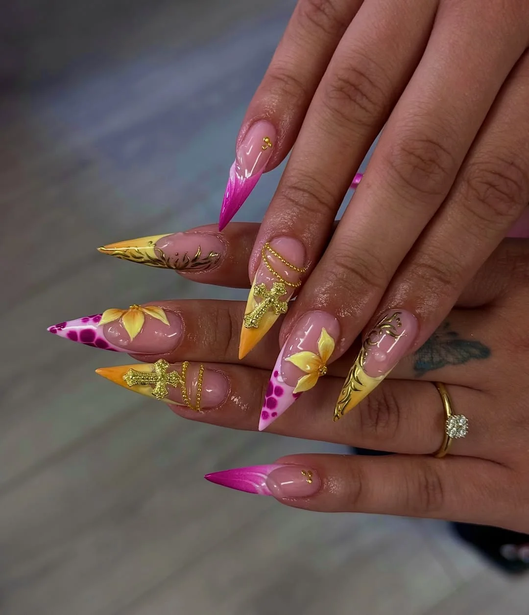 trendy summer nails 2026 Hot Pink And Yellow Stiletto Nails With Tropical Gold Accents