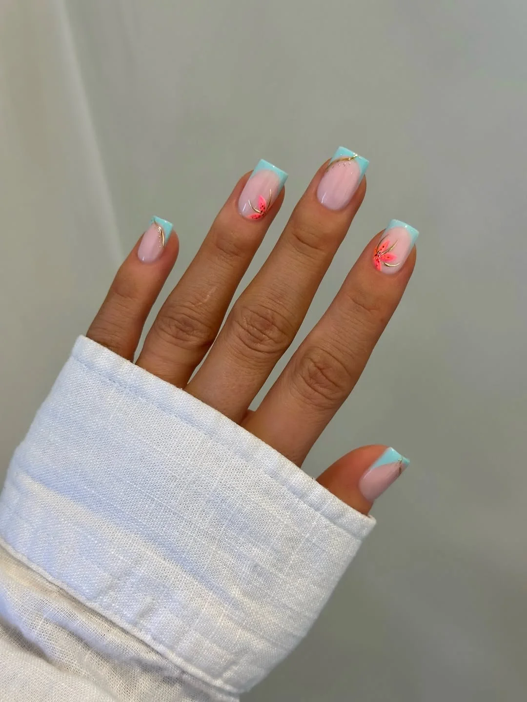 trendy summer nails 2026 Square Aqua French Tips With Coral Flower Accents