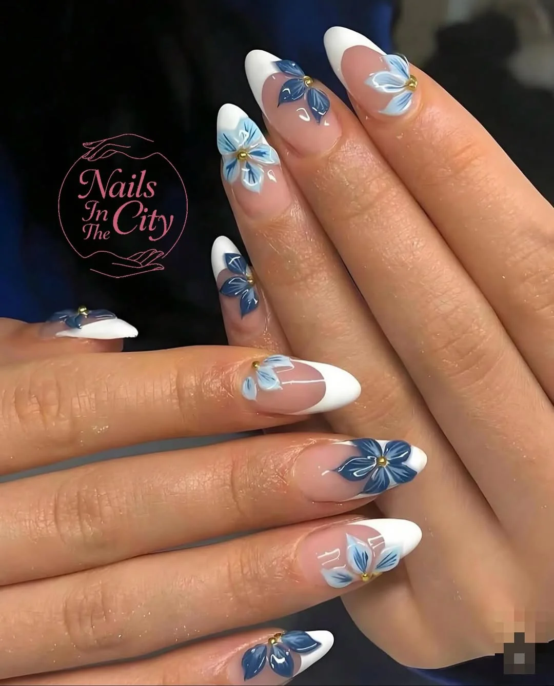 trendy summer nails 2026 White French Almond Nails With Blue Floral Art