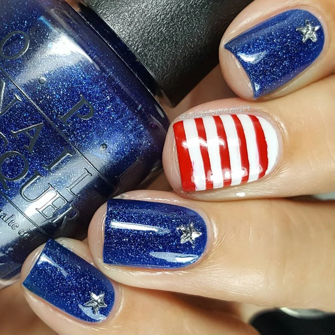 usa nails 2026 Shimmery Blue Patriotic Nails With Crisp Red And White Stripes