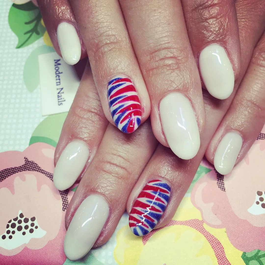 usa nails 2026 Soft Neutral Nails With Swirled Red, White, And Blue Accent Art