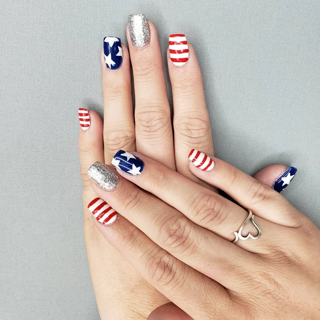 usa nails 2026 Bold Stars, Stripes, And Silver Glitter For A Festive Short Set