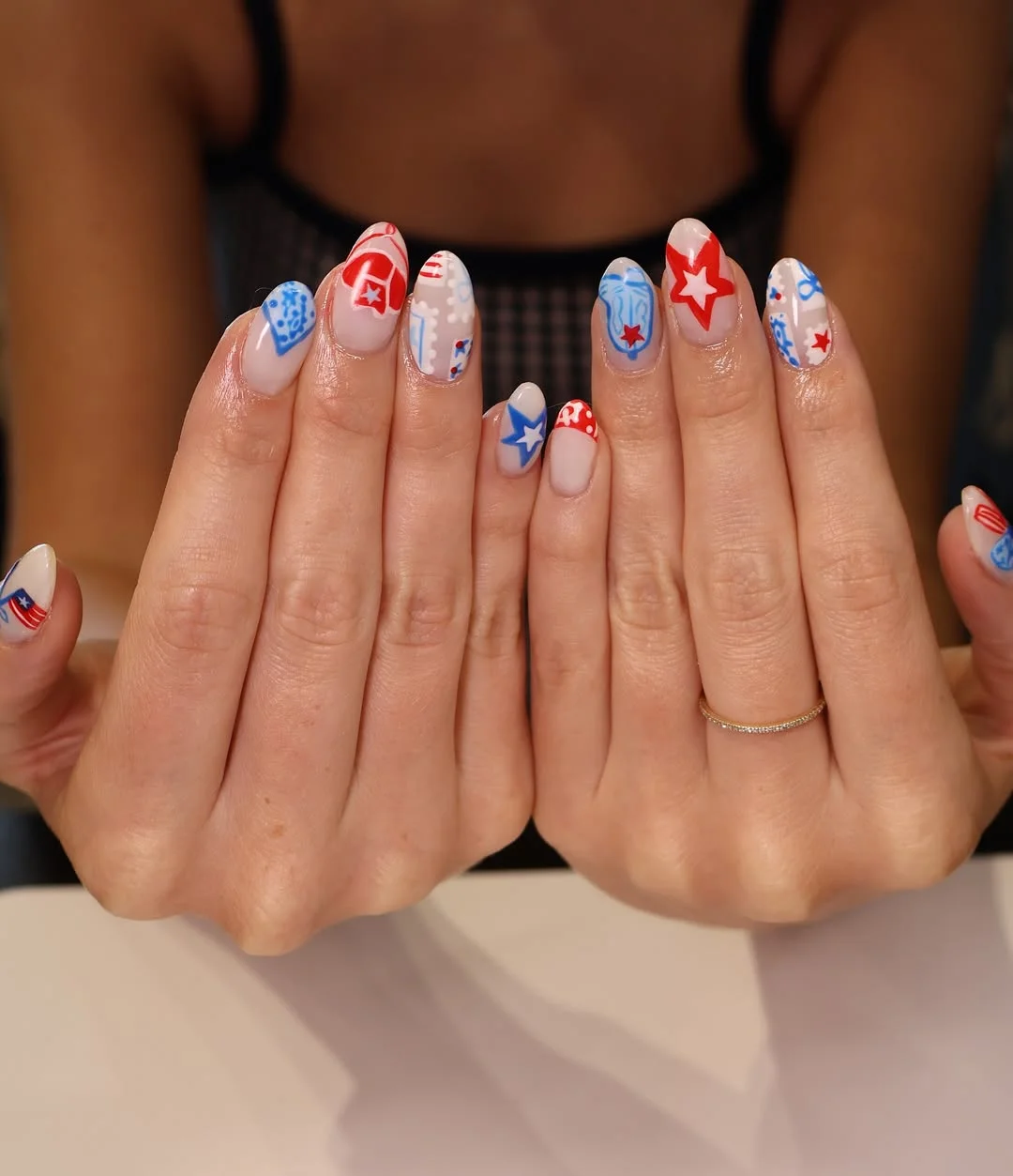 usa nails 2026 Soft Americana Almond Nails With Bandana Stars And Red-Blue Details