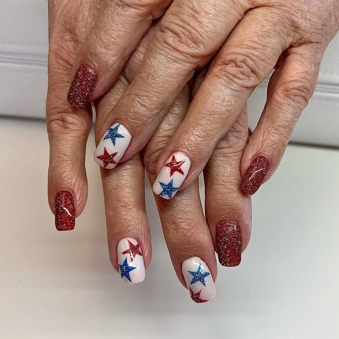 usa nails 2026 Red Glitter Nails With Sparkling Star Accent Art