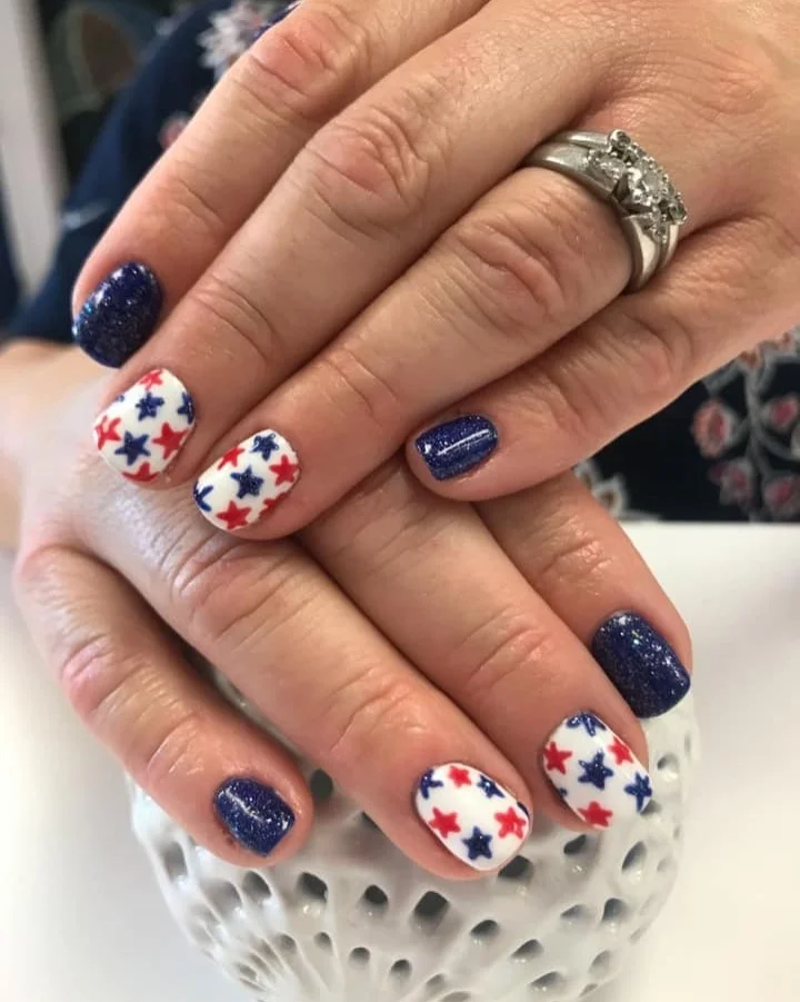usa nails 2026 Short Navy Glitter Nails With Red And White Star Accents