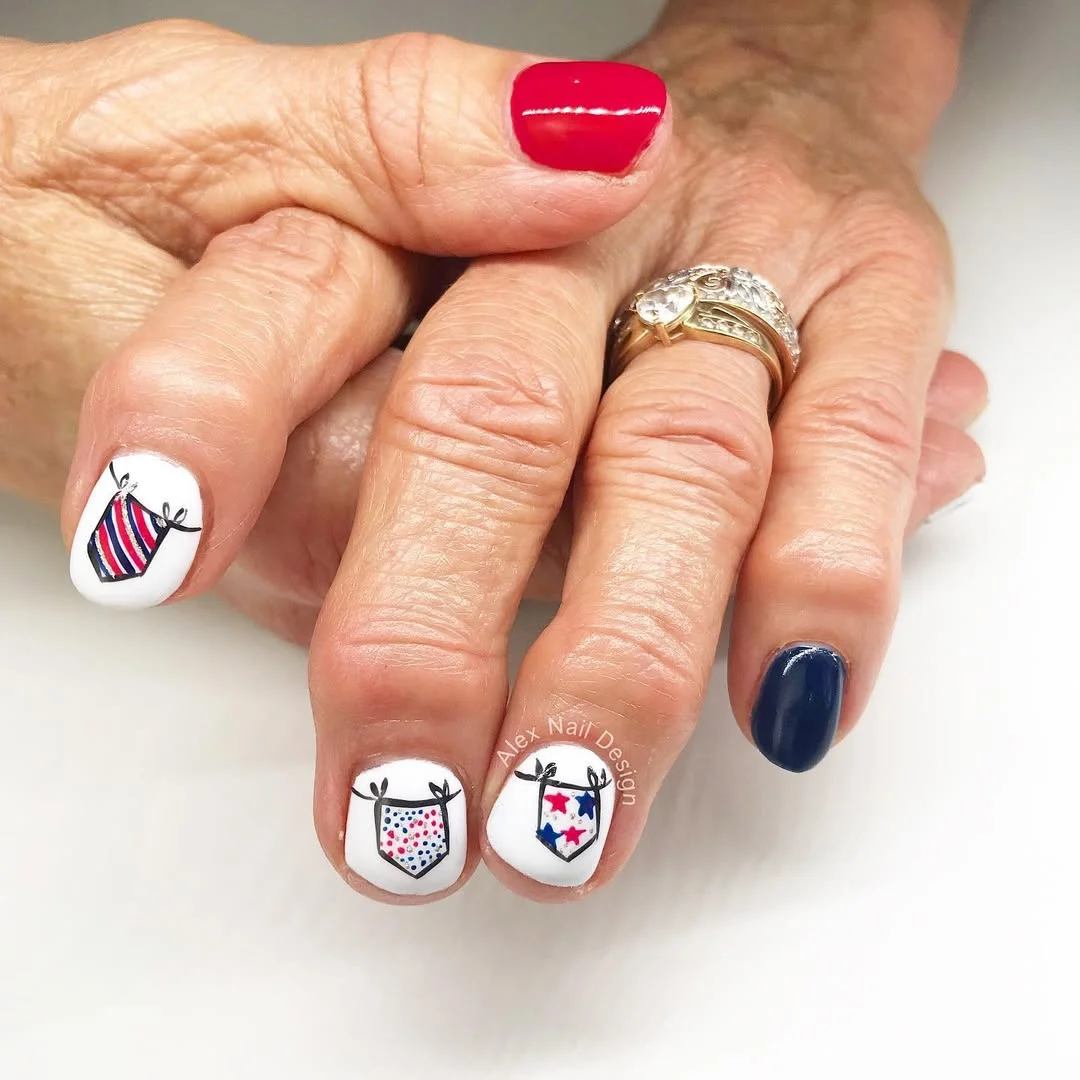 usa nails 2026 Simple Red And Navy Nails With Tiny Patriotic Pennants